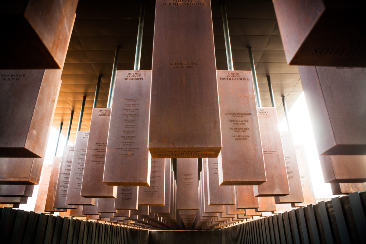 photo of the corridor at the National Monument for Peace and Justice in Montgomery, Alabama, the nation’s first memorial dedicated to the legacy of enslaved black people.