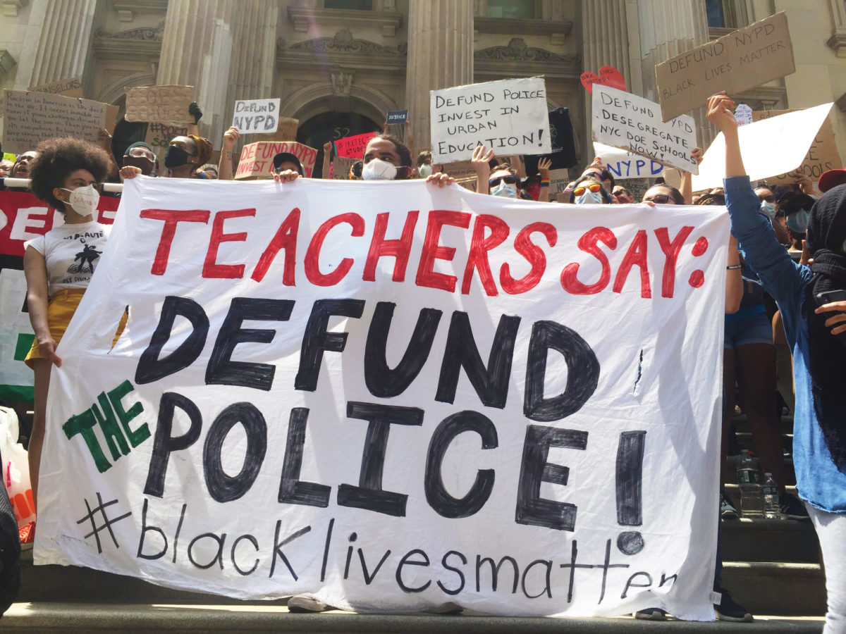 A photo of students, parents, and educators organized by Teachers Unite rallying on the steps of City Hall in New York City on June 6, 2020 to call for the removal of New York Police Department officers from NYC's public schools.